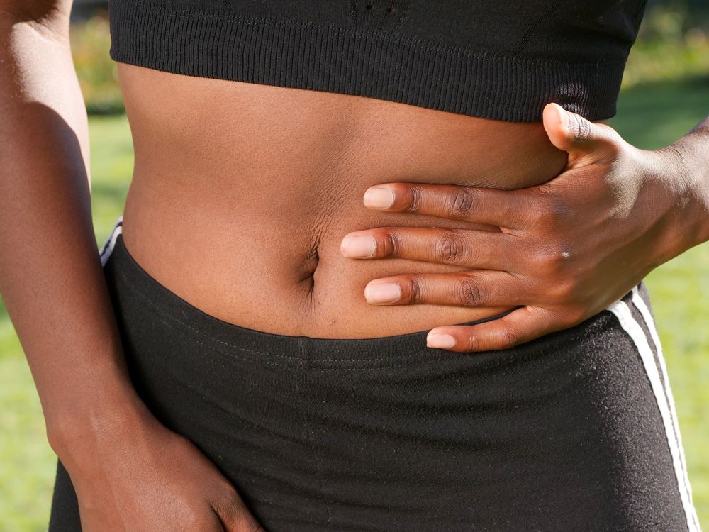 Person holding their abdomen