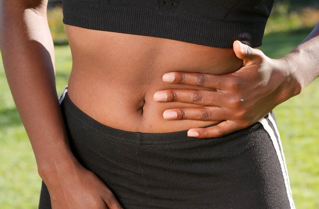 Person holding their abdomen