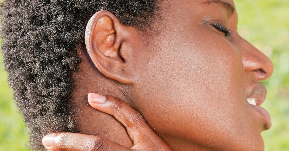 A person receiving a Swedish massage with long flowing strokes on their back.