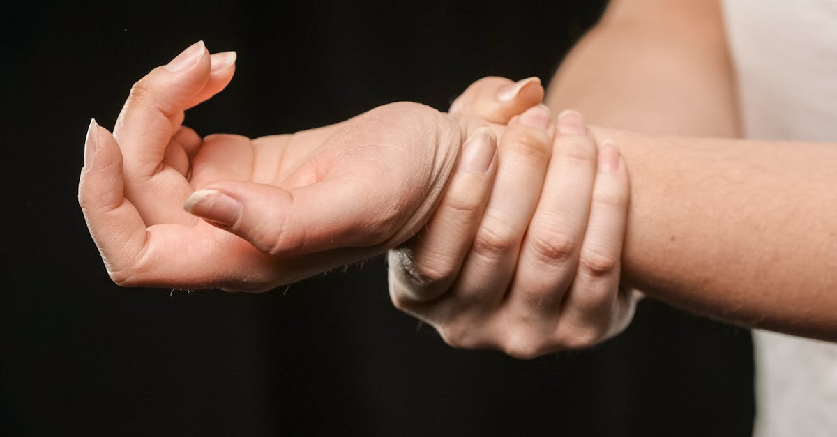 Person receiving reflexology foot massage for migraine relief.