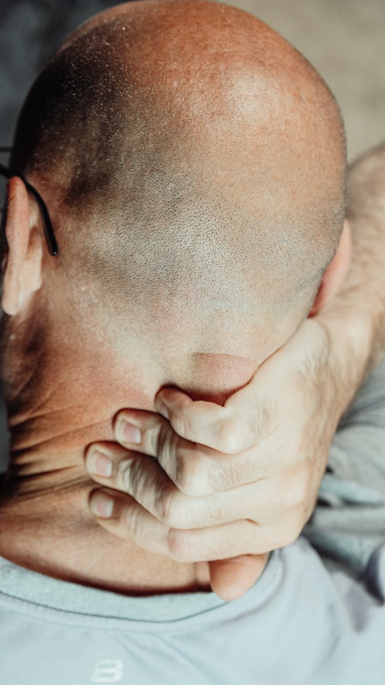 A Man Massaging His Nape