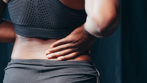 Free A Person Having a Back Pain Stock Photo