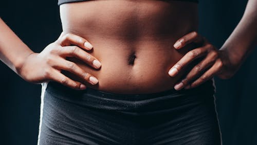 Free A Person Touching Her Belly Stock Photo