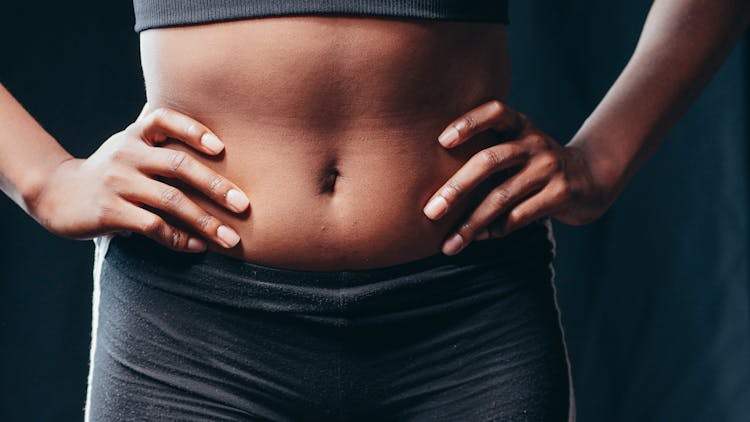 A Woman Holding Her Stomach