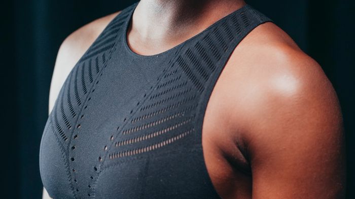 Close-up of a perforated black support bra. Photo by Kindel Media on Pexels