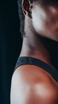 Artistic close-up of an African American person in profile with soft lighting.