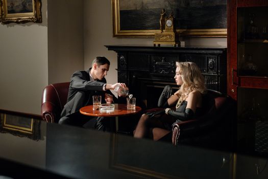Photo of Man Pouring his Date's Drink