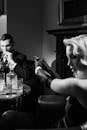 Photo of Female Mobster Pointing the Gun on Man