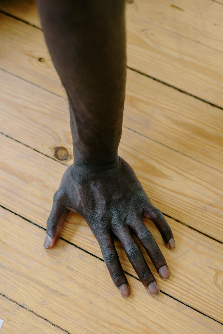 A Hand On A Pushing The Wooden Surface