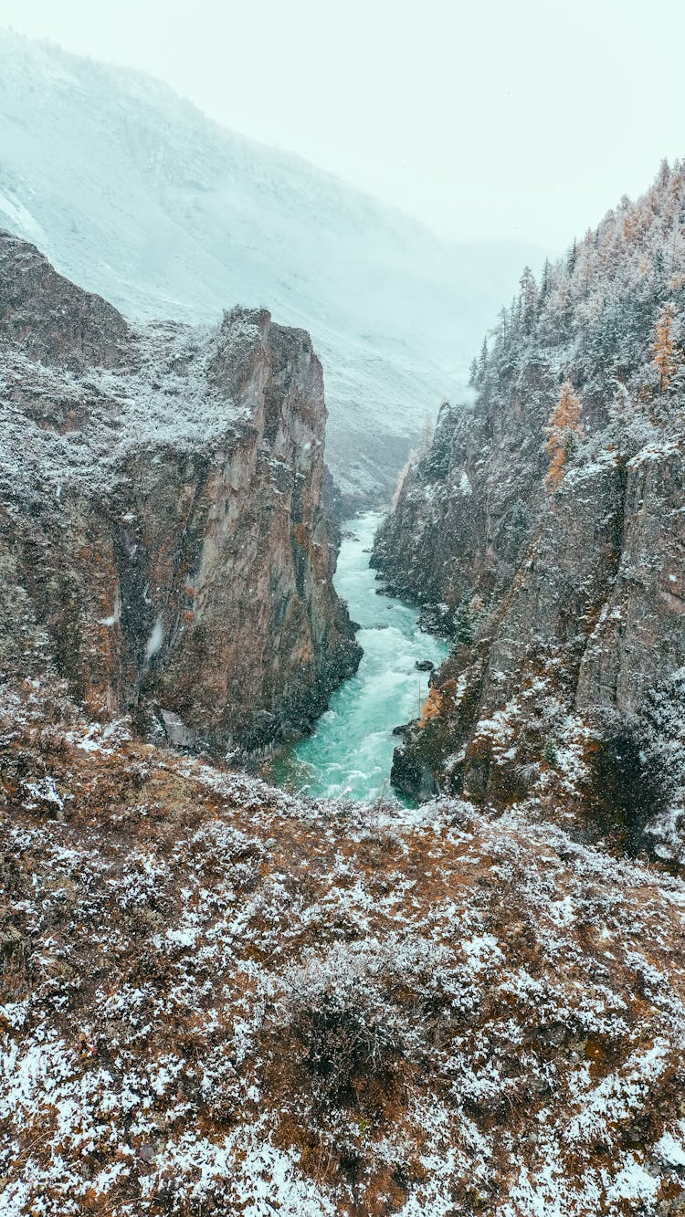 A River In The Middle Of Frosty Mountains