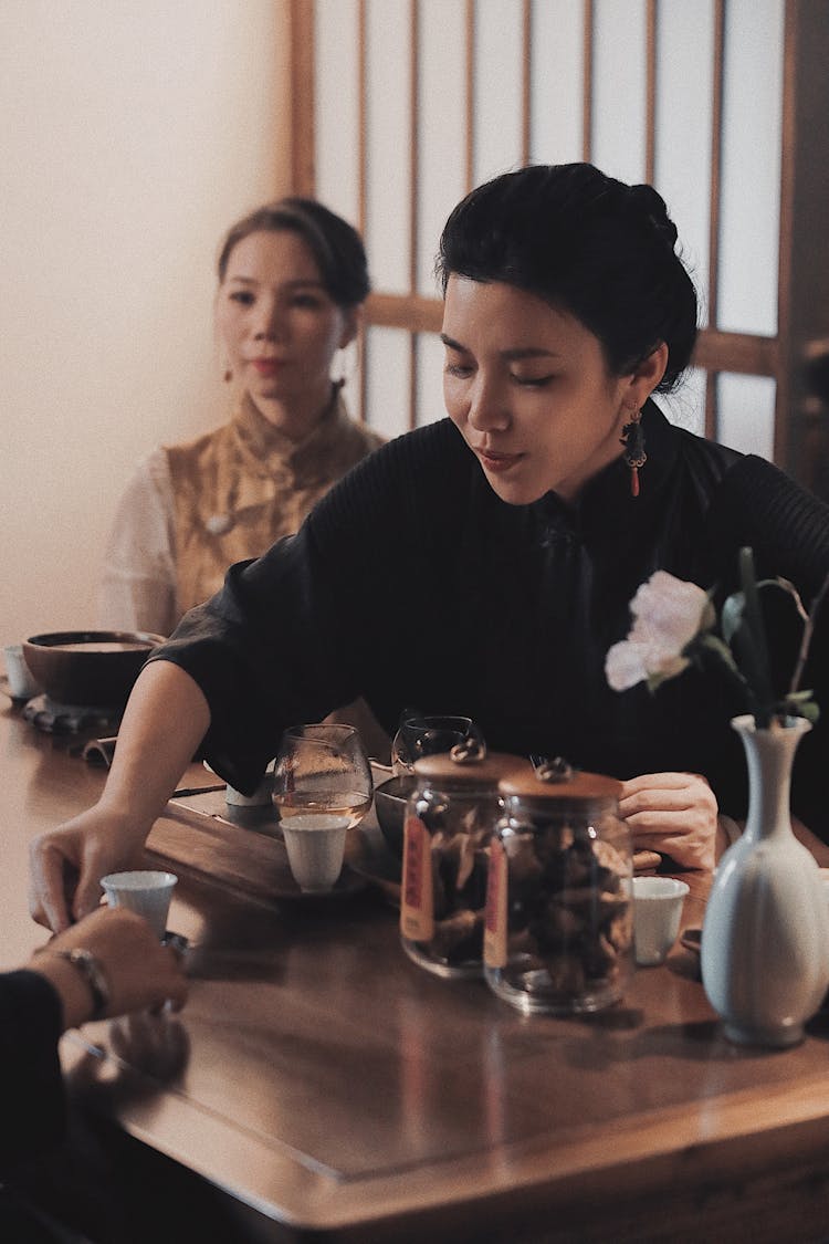 Woman Serving Traditional Tea 