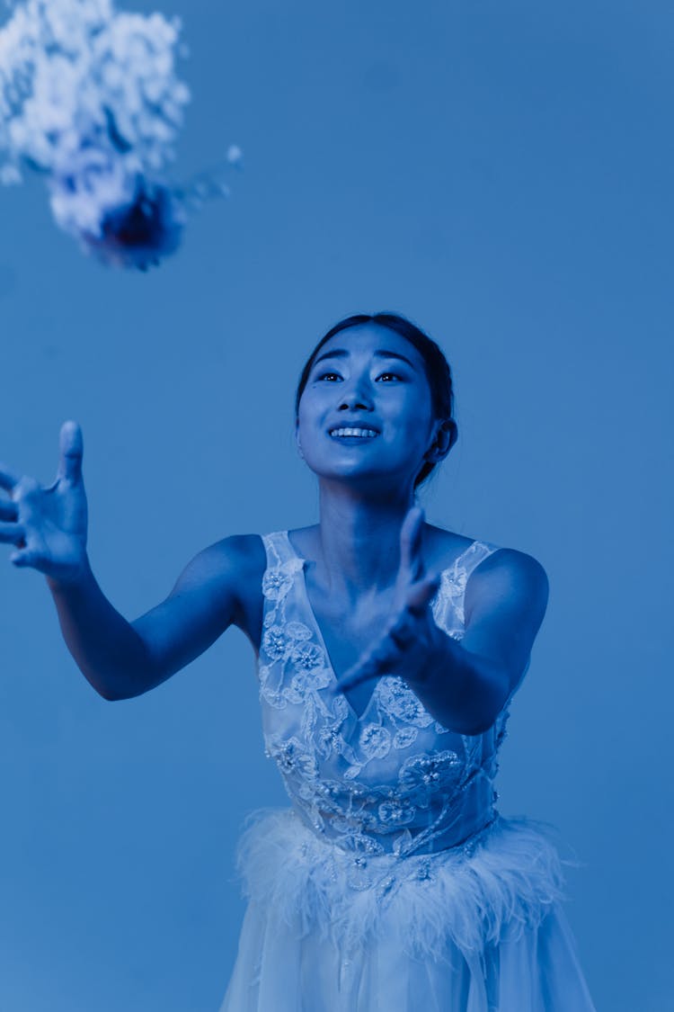 A Woman Catching A Bouquet Of Flower