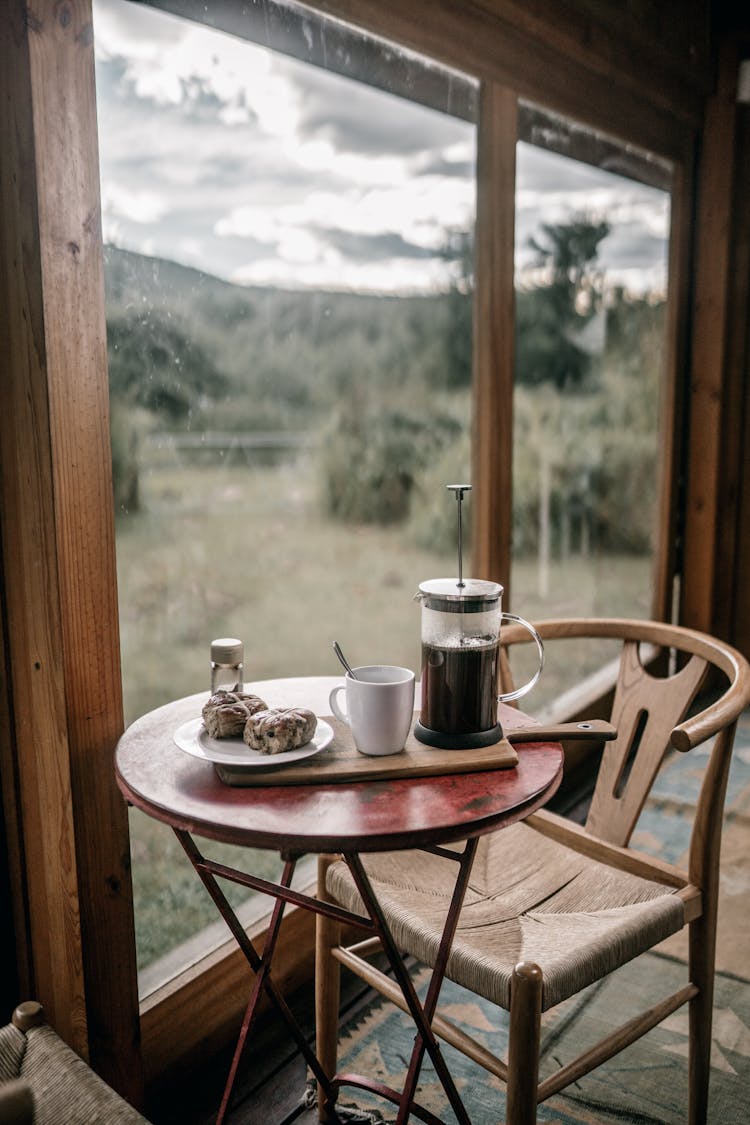 Coffee And Bread On A Round Wooden Table