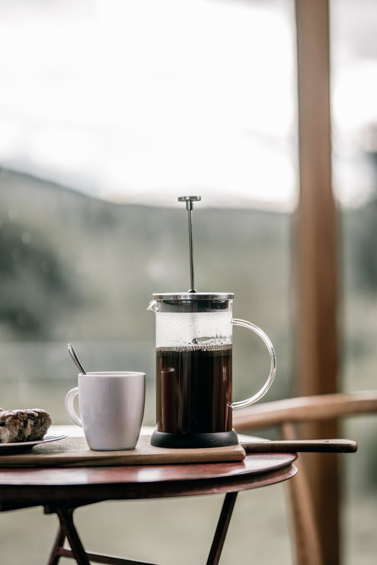 French Press And A Ceramic Mug