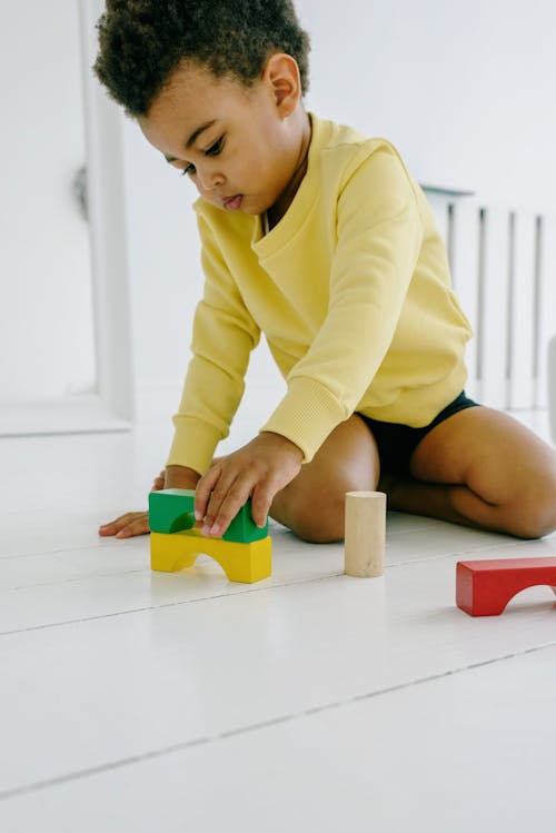 A Boy Playing on the Floor