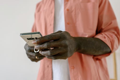 Close-up of Man Using Smartphone 