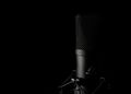 Studio microphone against a dark background, photo by Nishant Ghosh on Pexels