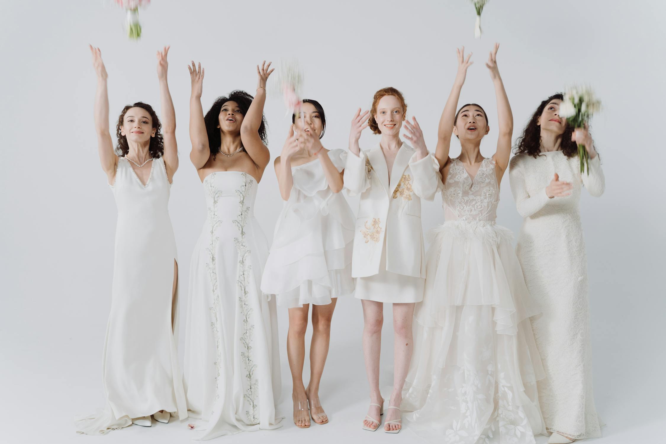 Women in White Dresses Throwing Bouquet of Flowers · Free Stock Photo