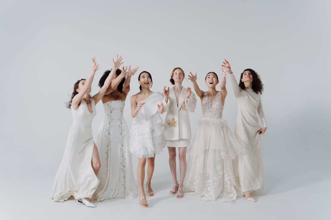 three women in white dresses