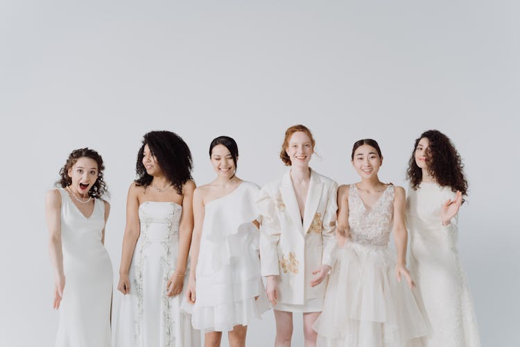 A Group Of Happy Women In White Dress