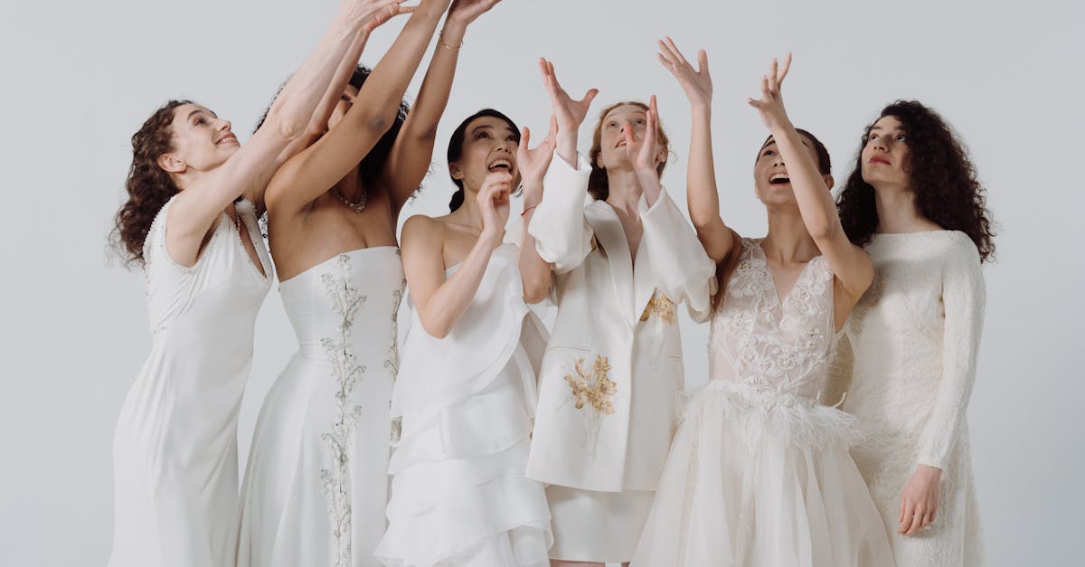 Women in White Dresses Raising Hands · Free Stock Photo