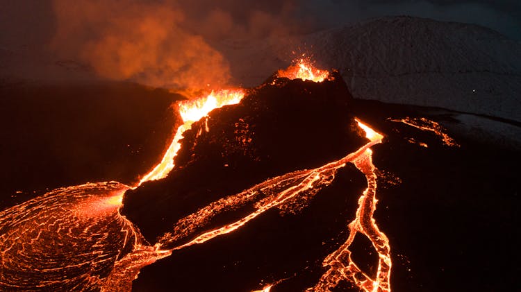 Aerial Photography Of An Erupting Volcano During Nighttime