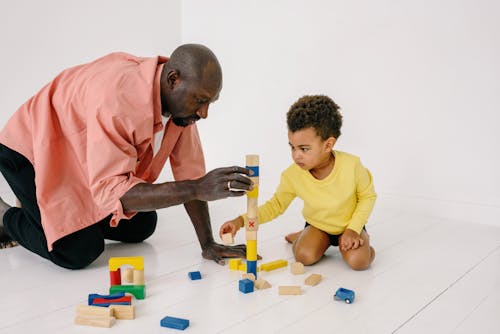 
A Father Playing Wooden Blocks with His Son