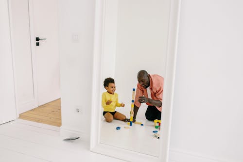 A Father Playing Wooden Blocks with His Son