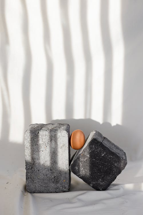 An Egg Between Concrete Blocks