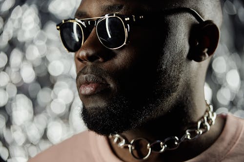 Man Wearing Sunglasses in Close Up Photography