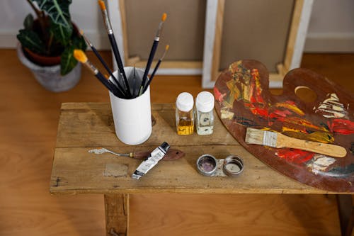 Painting Materials on a Wooden Stool