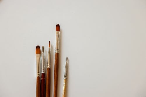 Different Paint Brushes on White Surface