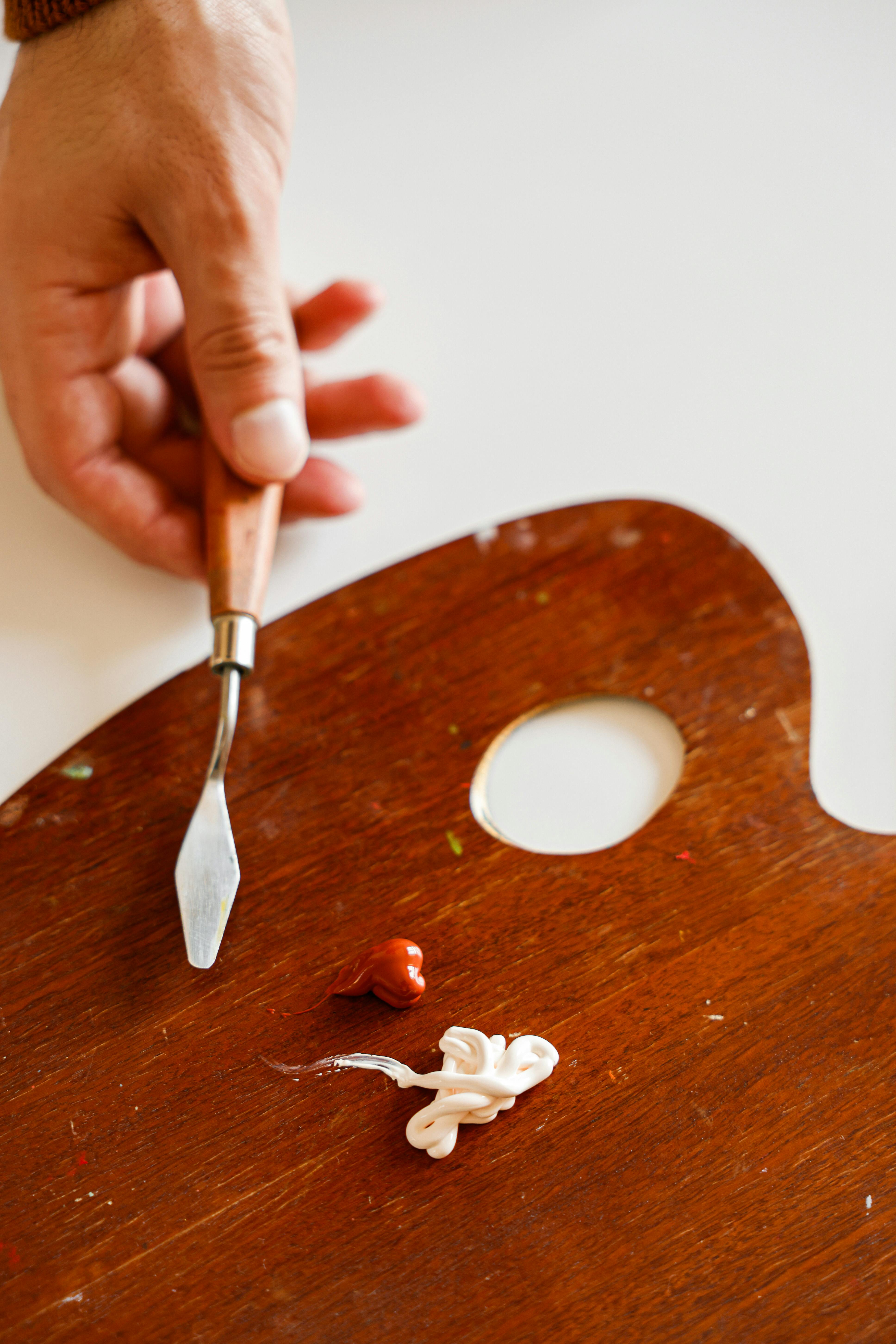 Close-Up Shot of a Painter Putting Acrylic Paint on a Palette