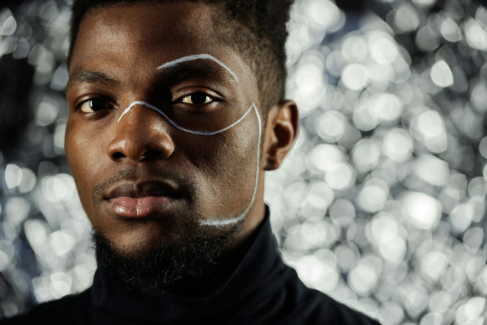 Man in Black Crew Neck Shirt Wearing Eyeglasses