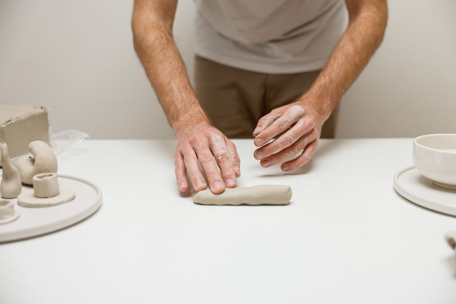 Hands working with clay in an art therapy session Hands working with clay in an art therapy session