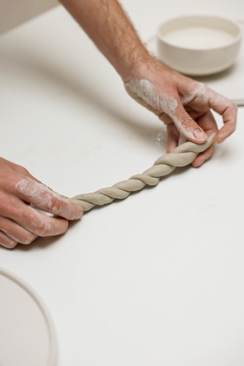 Person Making a Twisted Clay