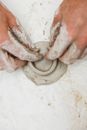 A Person Hands Engaged in Clay Pottery