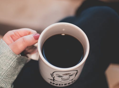 Free Black Beverage in White and Black Ceramic Mug Stock Photo