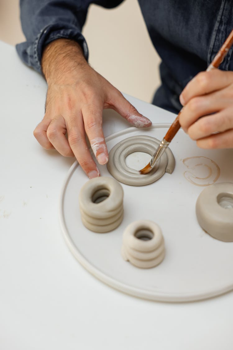 Person Painting Clay