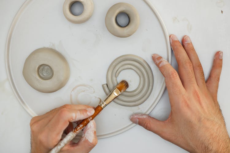 Person Painting Clay