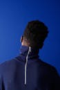 A Man in Blue Zip Up Jacket