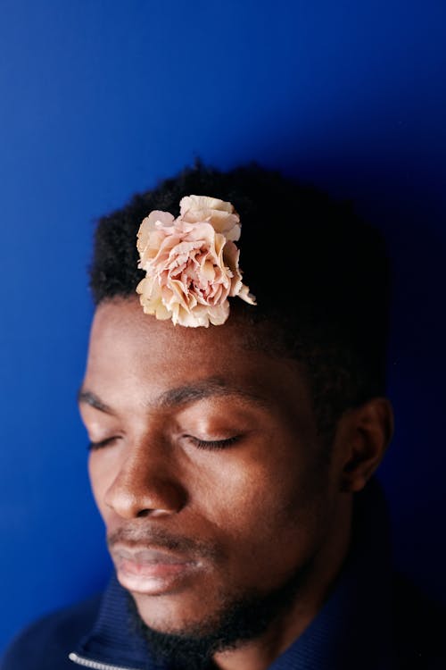 A Man with Flower on His Head