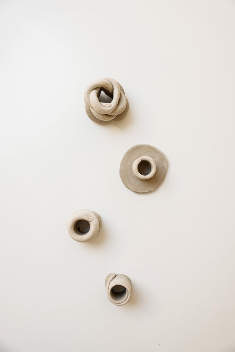 Clay Sculptures On A White Background