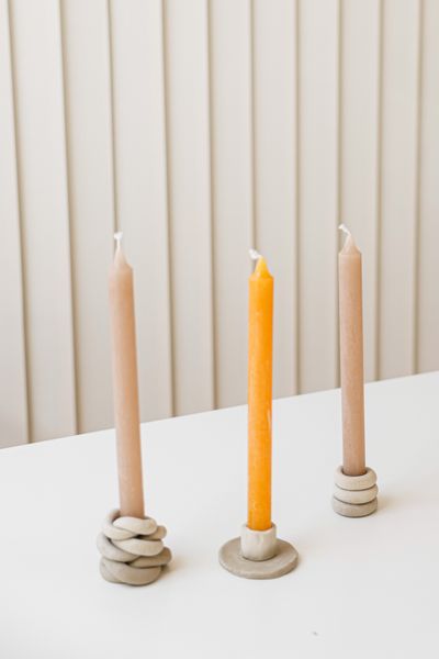 Tapered dinner candles in sand — photo by Cup of  Couple on Pexels