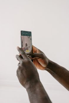A person captures a photo using a smartphone, highlighting mobile photography techniques.