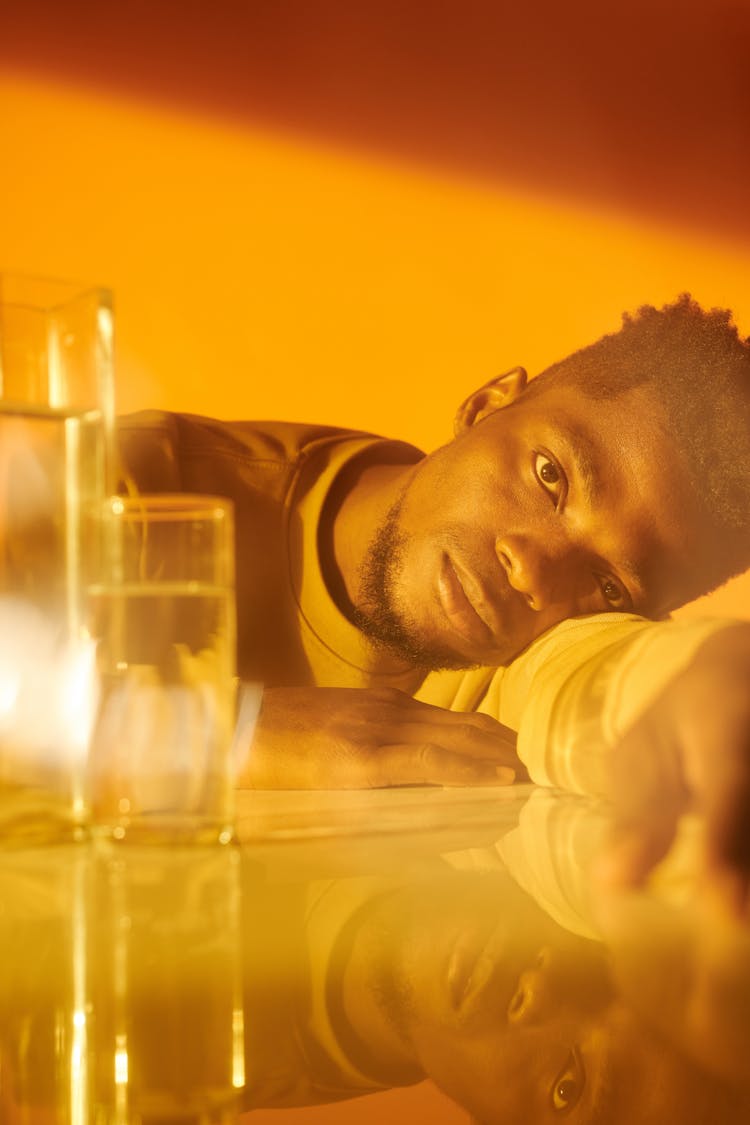 A Man Lying On The Table 