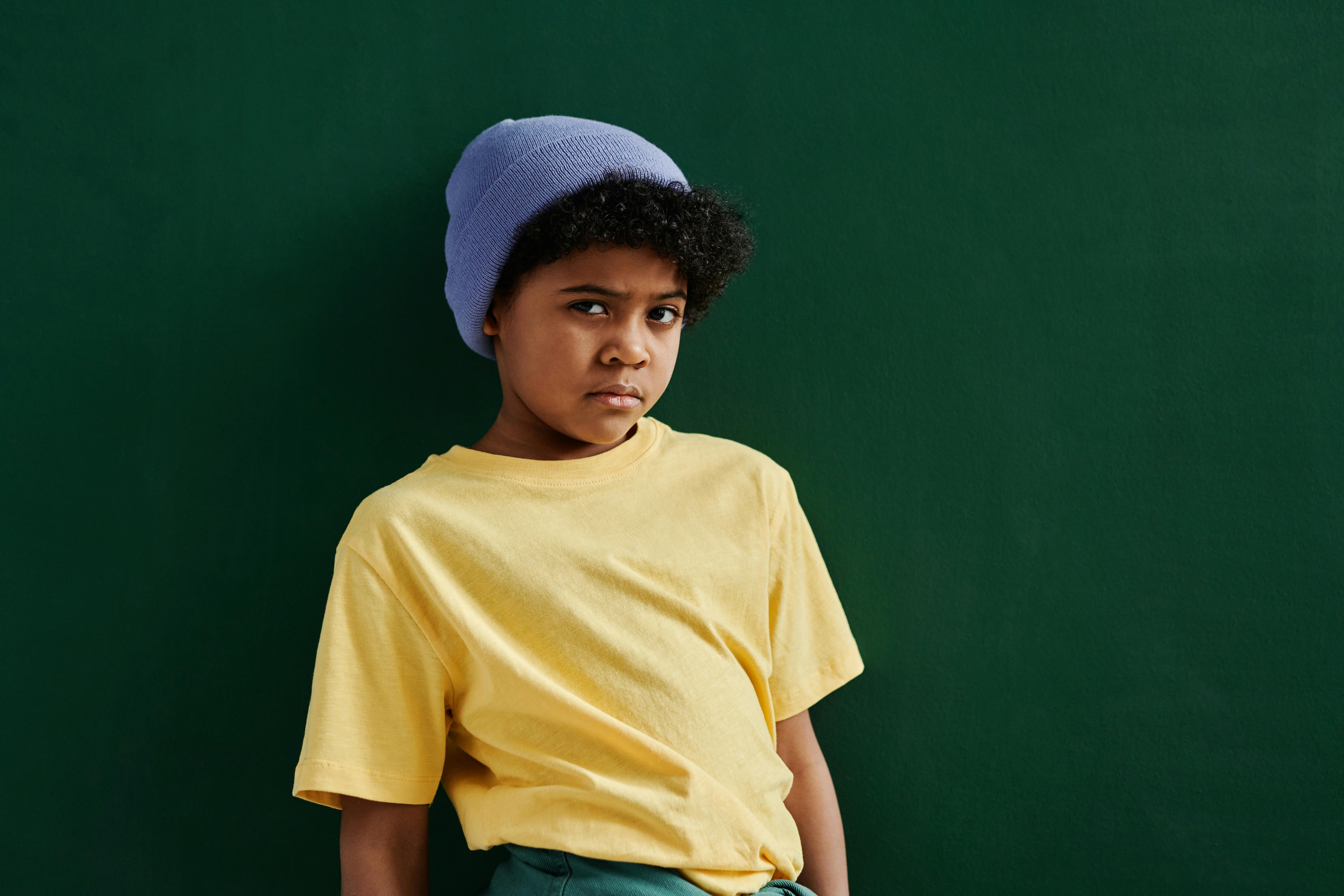 Boy in Yellow Crew Neck Tshirt and Blue Knit Cap · Free Stock Photo