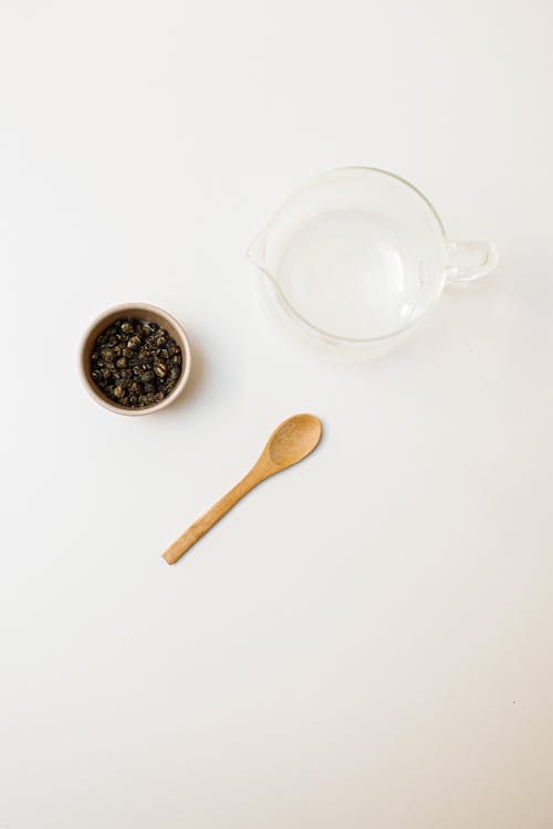 Free Top View of a Coffee Beans in a Bowl and a Glass Pitcher Stock Photo