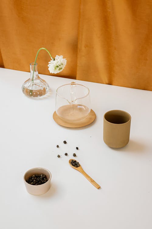 Free Wooden Cup and Spoon and Coffee Beans on the Table  Stock Photo