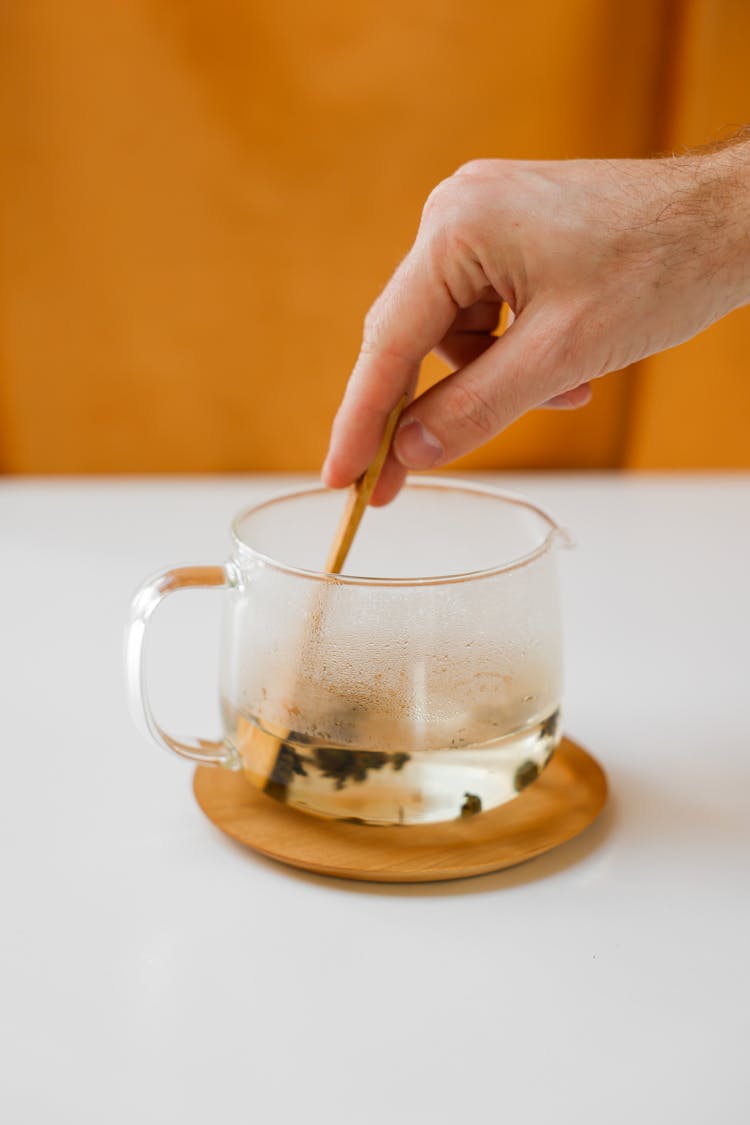 A Person Mixing Tea